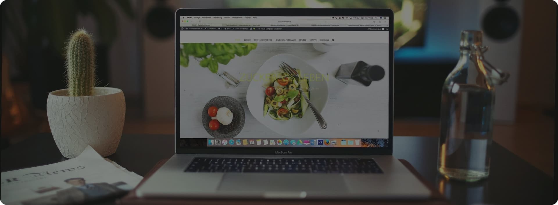 Workspace with laptop showing Atomicat builder
